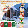Lighted penguins decoration with warm white lights, featuring hats and scarves, ideal for festive outdoor displays.