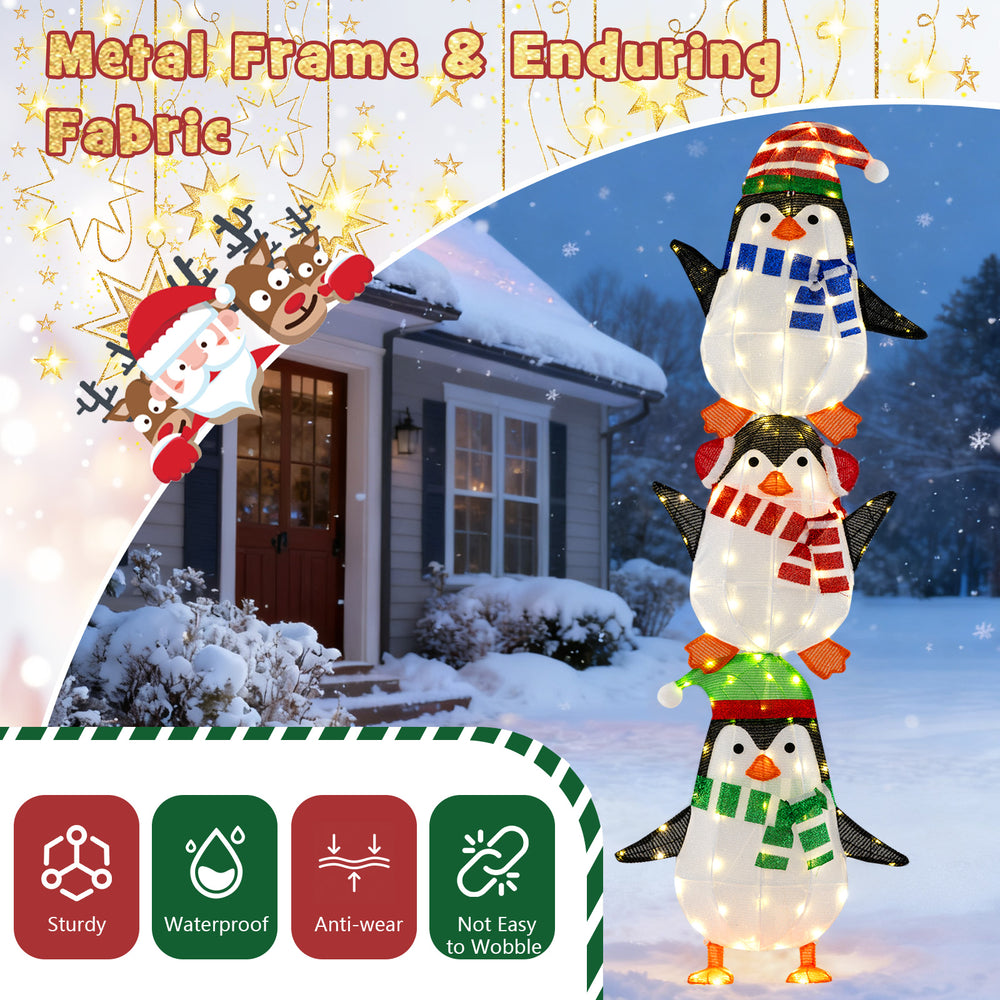 Lighted penguins decoration with warm white lights, featuring hats and scarves, ideal for festive outdoor displays.