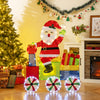 Lighted Santa on a train decoration with LED lights, featuring gift boxes and lighted wheels for festive indoor or.