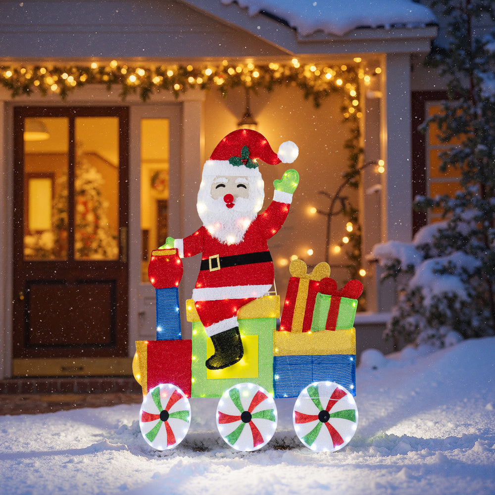 Lighted Santa on a train decoration with LED lights, featuring gift boxes and lighted wheels for festive outdoor.