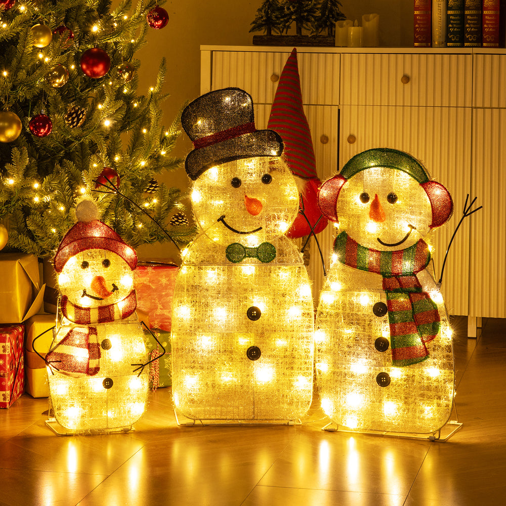 Lighted snowman family decoration set featuring a dad, mom, and baby, adorned with 95 warm-white LED lights for festive.