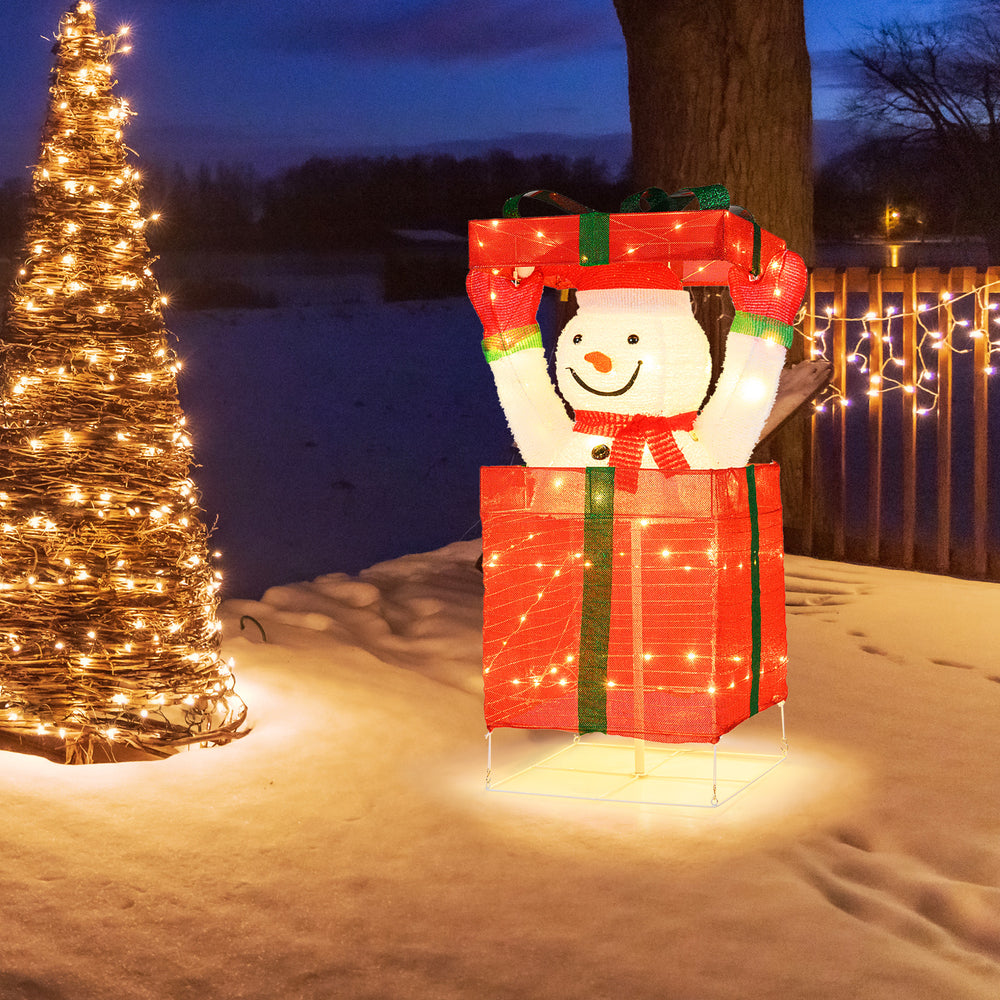 Lighted snowman in a gift box with 100 warm LED lights, perfect for festive outdoor Christmas decoration.