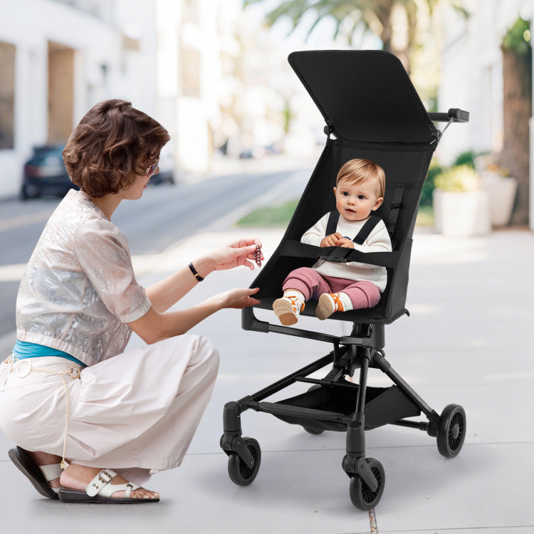 Lightweight airplane-ready stroller with all-terrain wheels, featuring a hammock seat and adjustable canopy for baby.