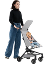 Lightweight gray baby stroller with adjustable canopy, compact design, and easy fold for travel convenience.