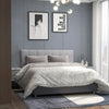 Linen upholstered headboard in gray with solid rubber wood legs, featuring button tufting for a modern bedroom decor.