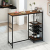 Rustic brown bar height dining table with storage shelves, stemware holders, and wine racks for versatile use.