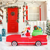 Side view of the inflatable red car with Santa and reindeer, featuring a gift bag and illuminated by 9 LED white lights.