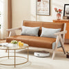 Brown loveseat sofa with rubber wood frame, padded seat, and throw pillows, perfect for small spaces and stylish.