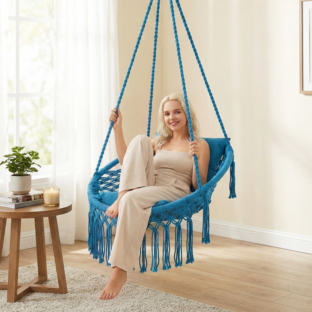 Macrame swing chair in navy with removable cushions, featuring a sturdy frame and bohemian style for indoor or outdoor.