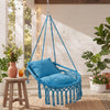 Macrame swing chair hammock in blue with removable cushions, featuring decorative fringes for indoor or outdoor use.
