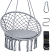 Macrame swing chair in grey with round seat cushion, sturdy metal frame, and decorative fringes for indoor or outdoor.