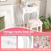 Vintage vanity desk set in white with floral cushion, featuring three drawers and elegant curved legs for stylish.