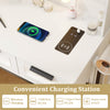 Convenient charging station on the white bedroom makeup vanity desk with wireless and USB charging options.