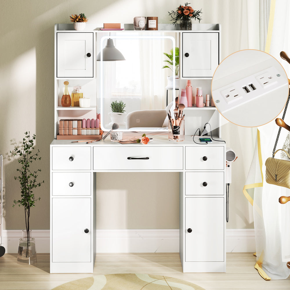 Makeup vanity desk in white featuring a lighted mirror, charging station, and ample storage with adjustable shelves.