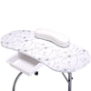 Portable white manicure nail table with floral design, comfy wrist cushion, and durable plastic drawer for accessories.
