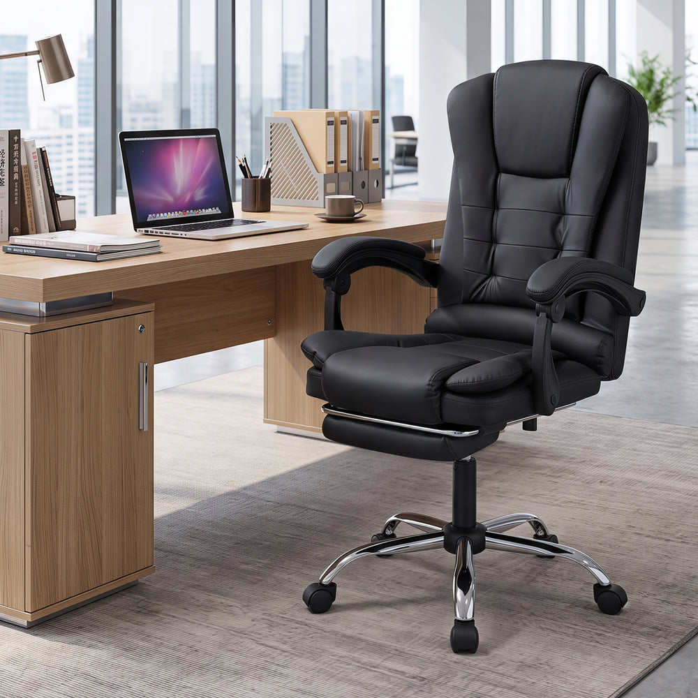 Massage office chair in black with reclining backrest, footrest, and swivel seat for ultimate comfort and support.
