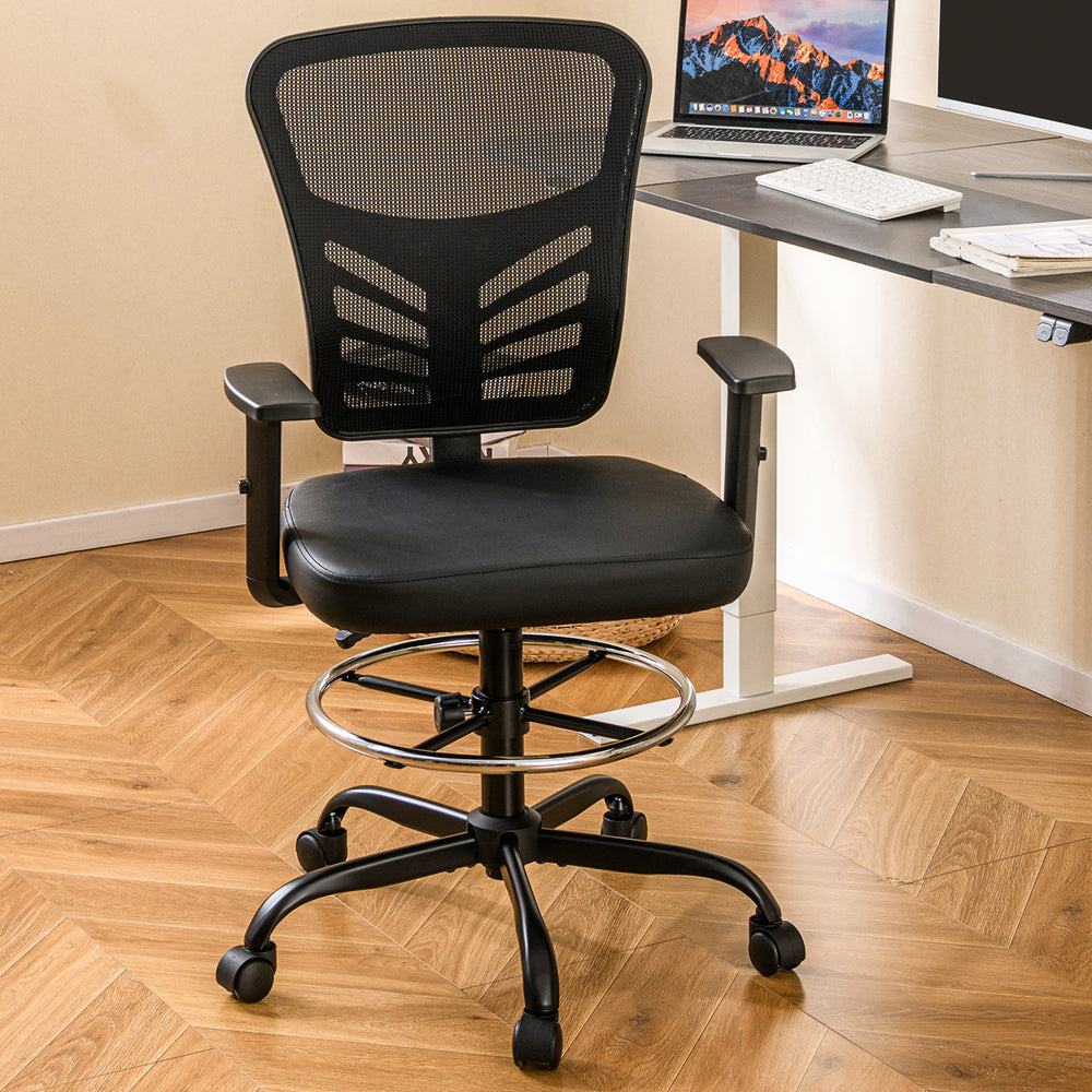 Black mesh drafting chair with adjustable armrests and foot-ring, featuring ergonomic backrest for office use.