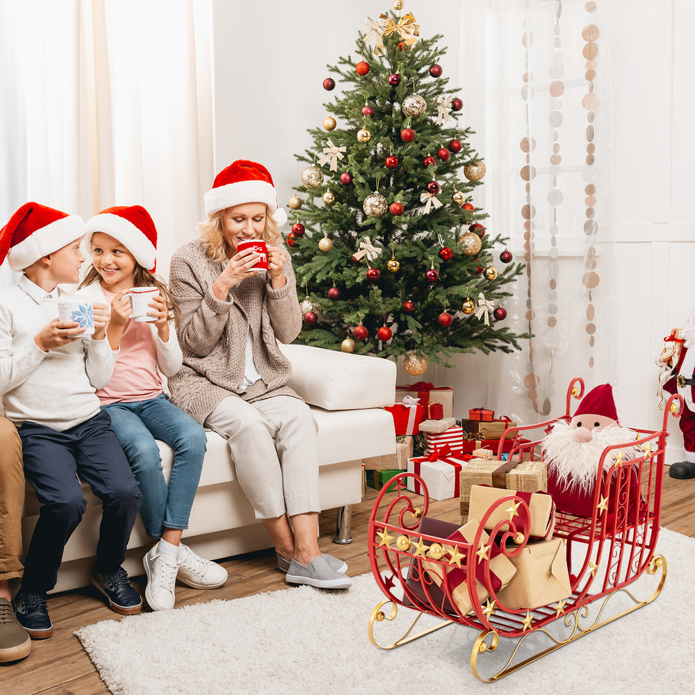 Metal Christmas Santa sleigh with large cargo area, featuring curled edges and golden star accents for festive.