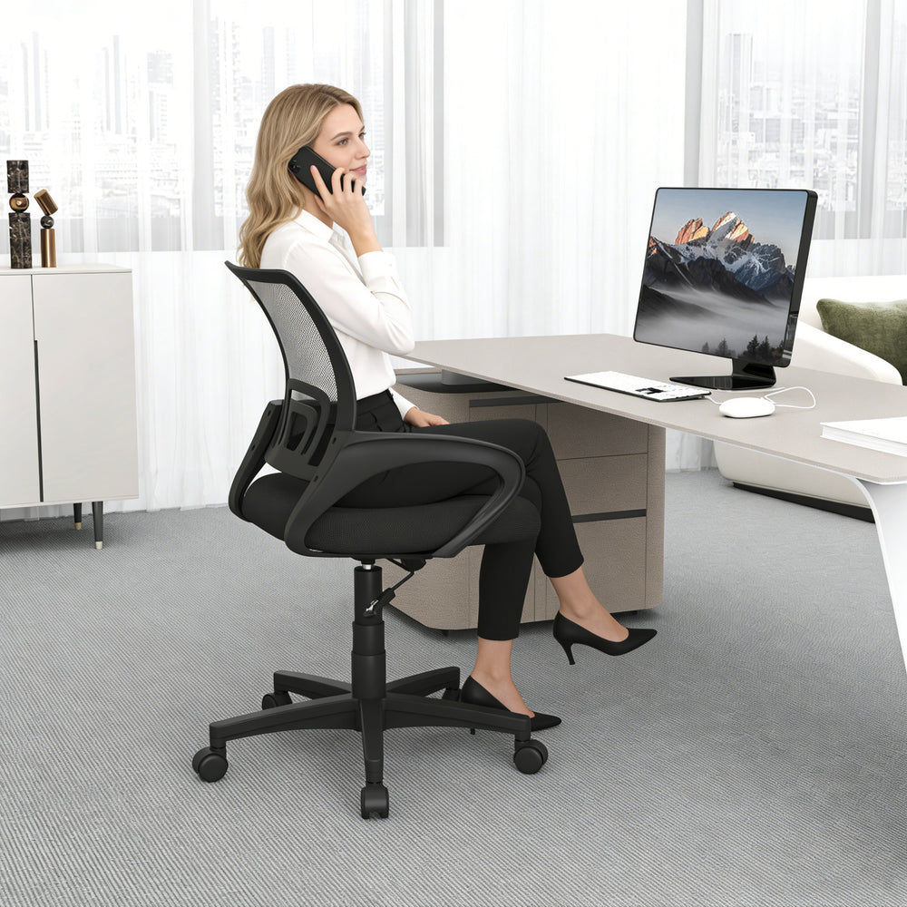 Mid-back mesh office chair with lumbar support, ergonomic design, and adjustable height for optimal comfort in a modern.
