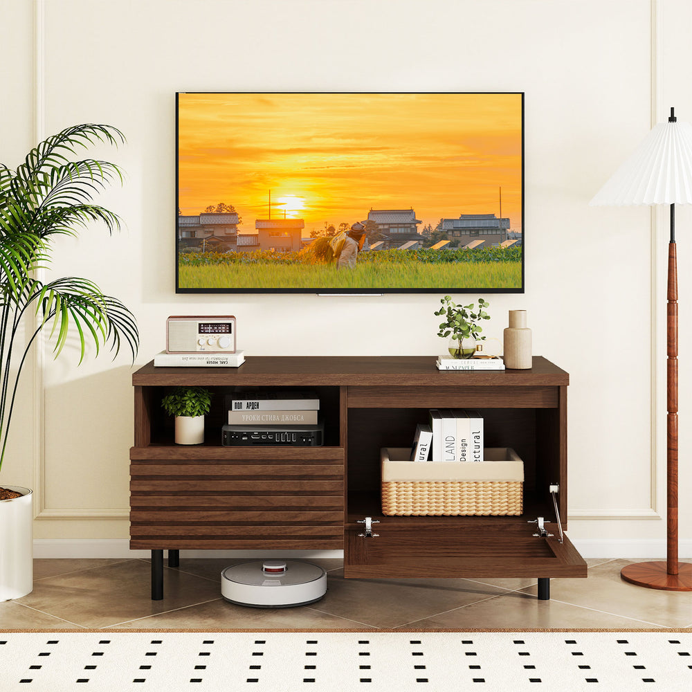 Mid Century fluted TV stand in walnut with open compartment, large drawer, and solid metal legs for modern.