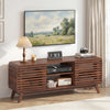 Mid Century Modern entertainment center in walnut with grille-style sliding doors, elegantly styled for living room.