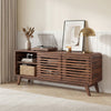 Mid Century Modern entertainment center in walnut with grille-style sliding doors, perfect for living room decor.