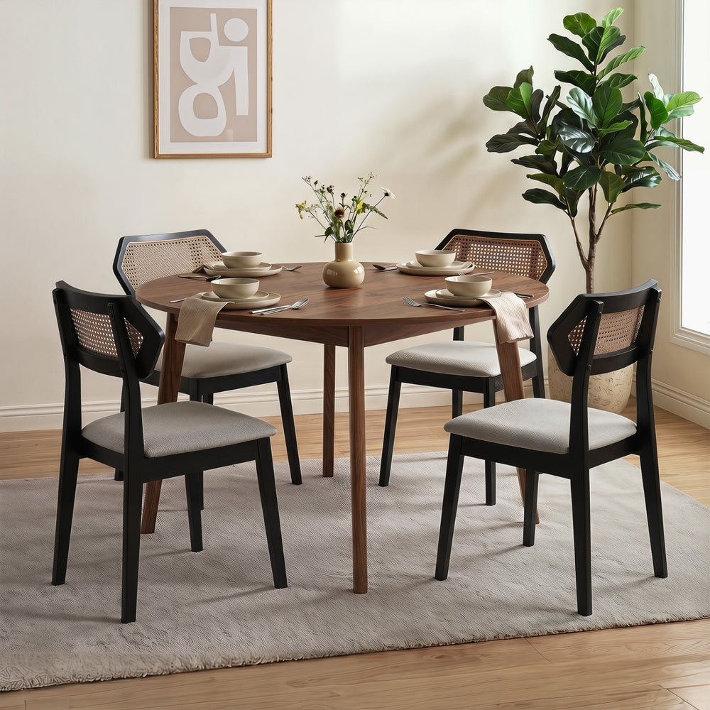 Set of four Mid Century dining chairs with rattan backs and solid wood frames, perfect for kitchens and dining rooms.