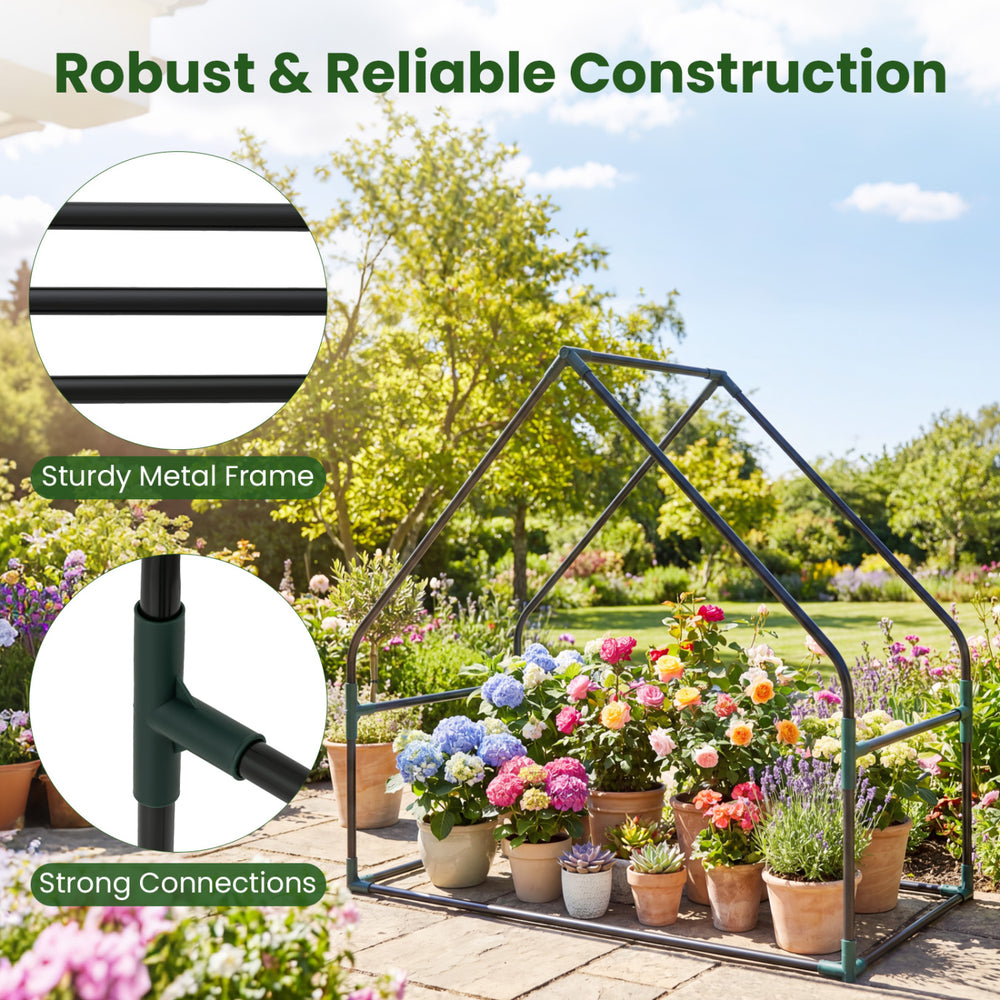 Mini greenhouse with a sturdy metal frame, waterproof bottom mat, and vibrant flowers, ideal for outdoor gardening.