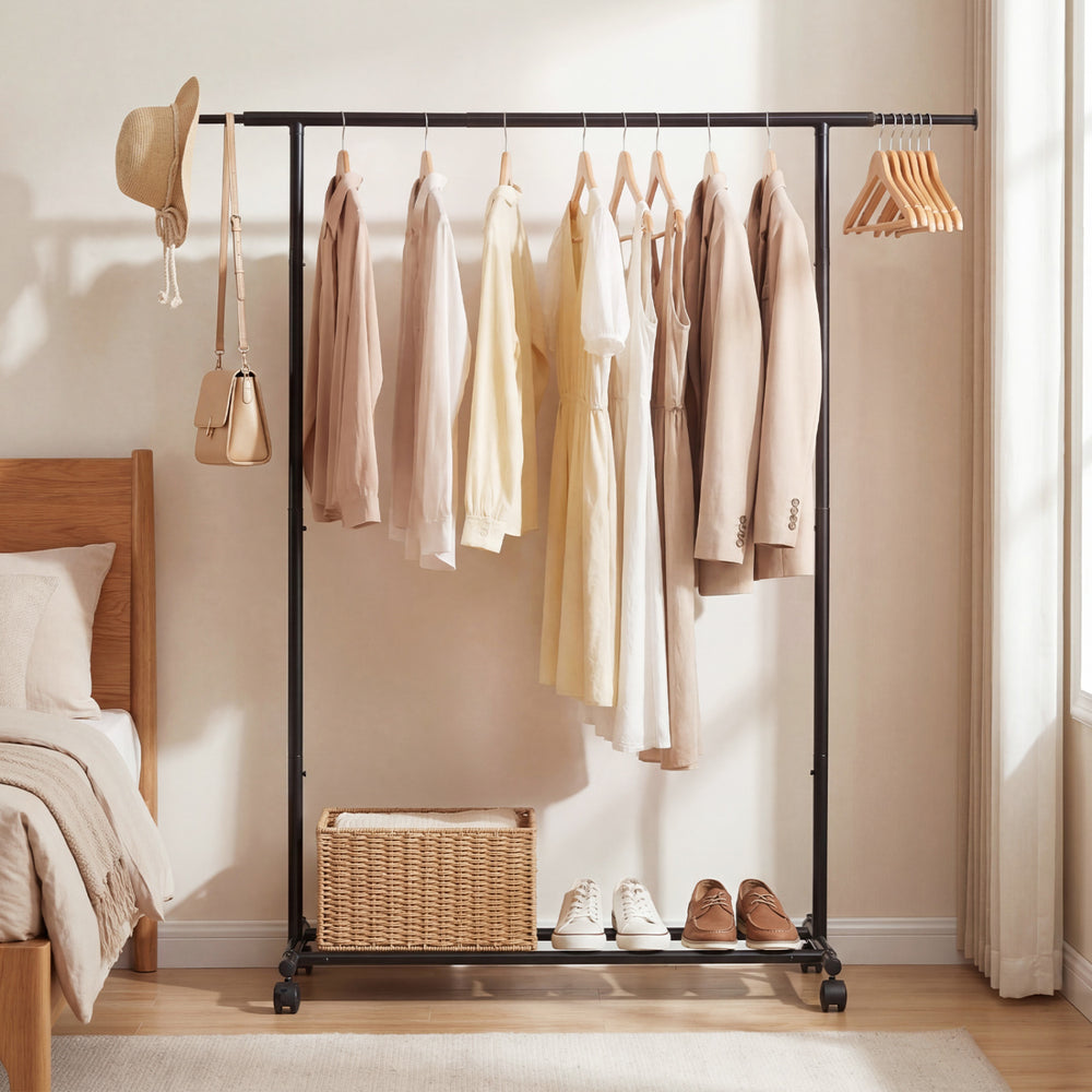 Mobile garment rack with extendable rods, featuring a sturdy metal frame and wheels for easy mobility in any room.