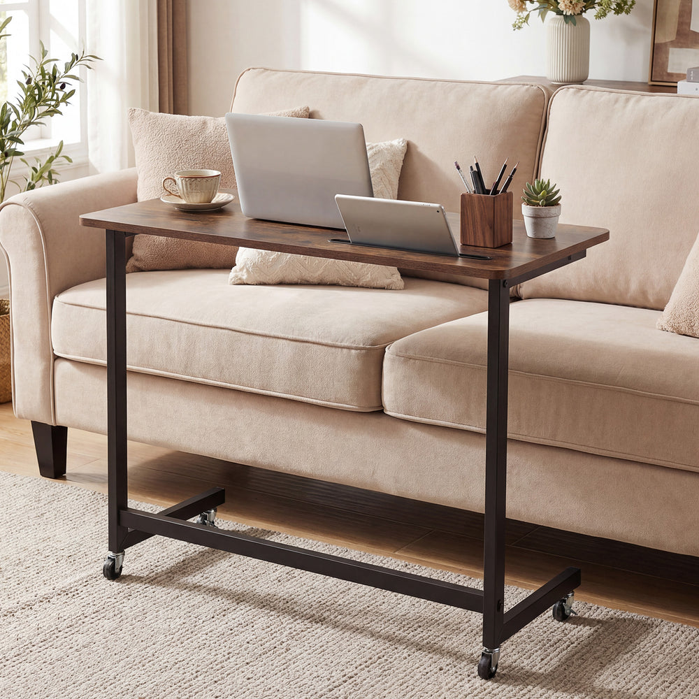 Mobile side table rolling laptop desk cart in rustic brown with tablet slot, ideal for living room or office use.