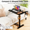 Compact C-shaped side table in black with adjustable height, cup holder, and rolling wheels for easy movement.