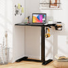 Mobile standing desk with adjustable height, black finish, cup holder, and headphone hook for versatile use.