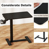 Height adjustable mobile standing desk in black with a spacious tabletop and cup holder, perfect for bedside use.