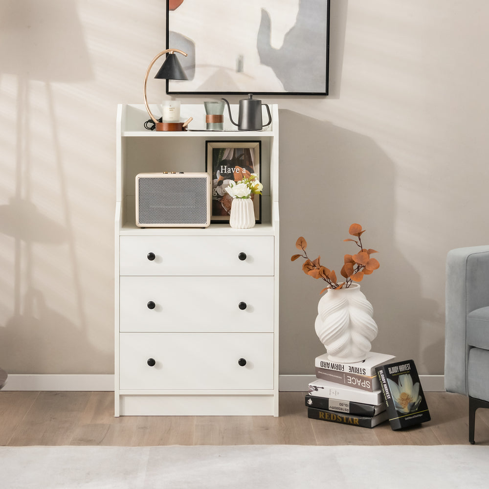 Modern white storage dresser with open shelves and three drawers, perfect for living room or bedroom organization.