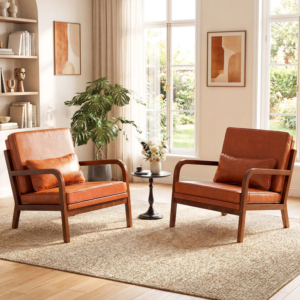 Modern accent chairs with faux leather upholstery and rubber wood frames, perfect for cozy living room seating.