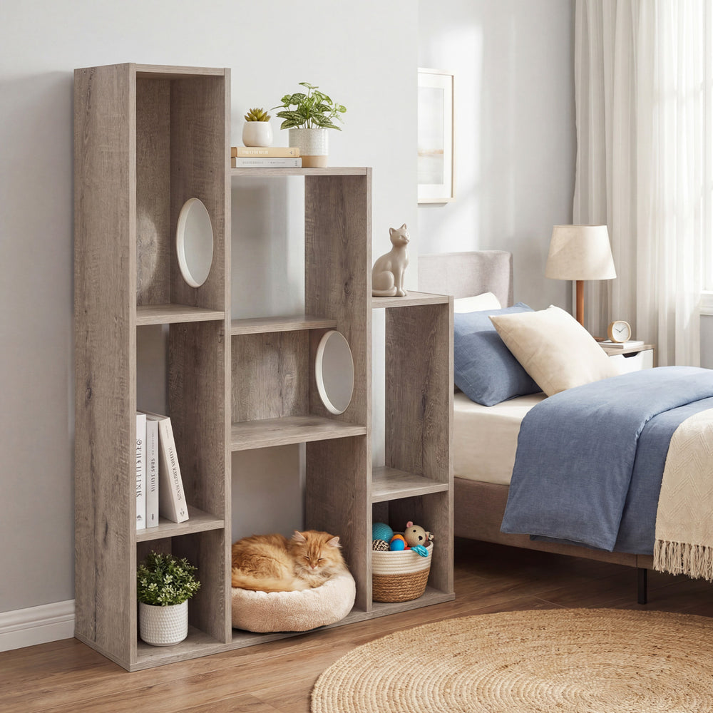 Modern cat bookshelf in gray oak with 8 sections, featuring dual round holes for cat hideaways and ample storage space.