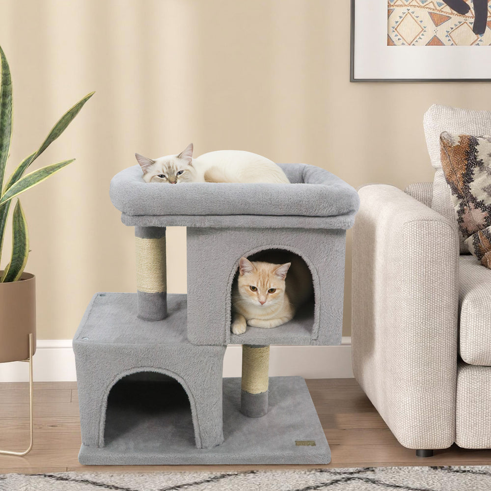Modern gray cat tree featuring two condos and an upholstered perch, ideal for small spaces and feline relaxation.