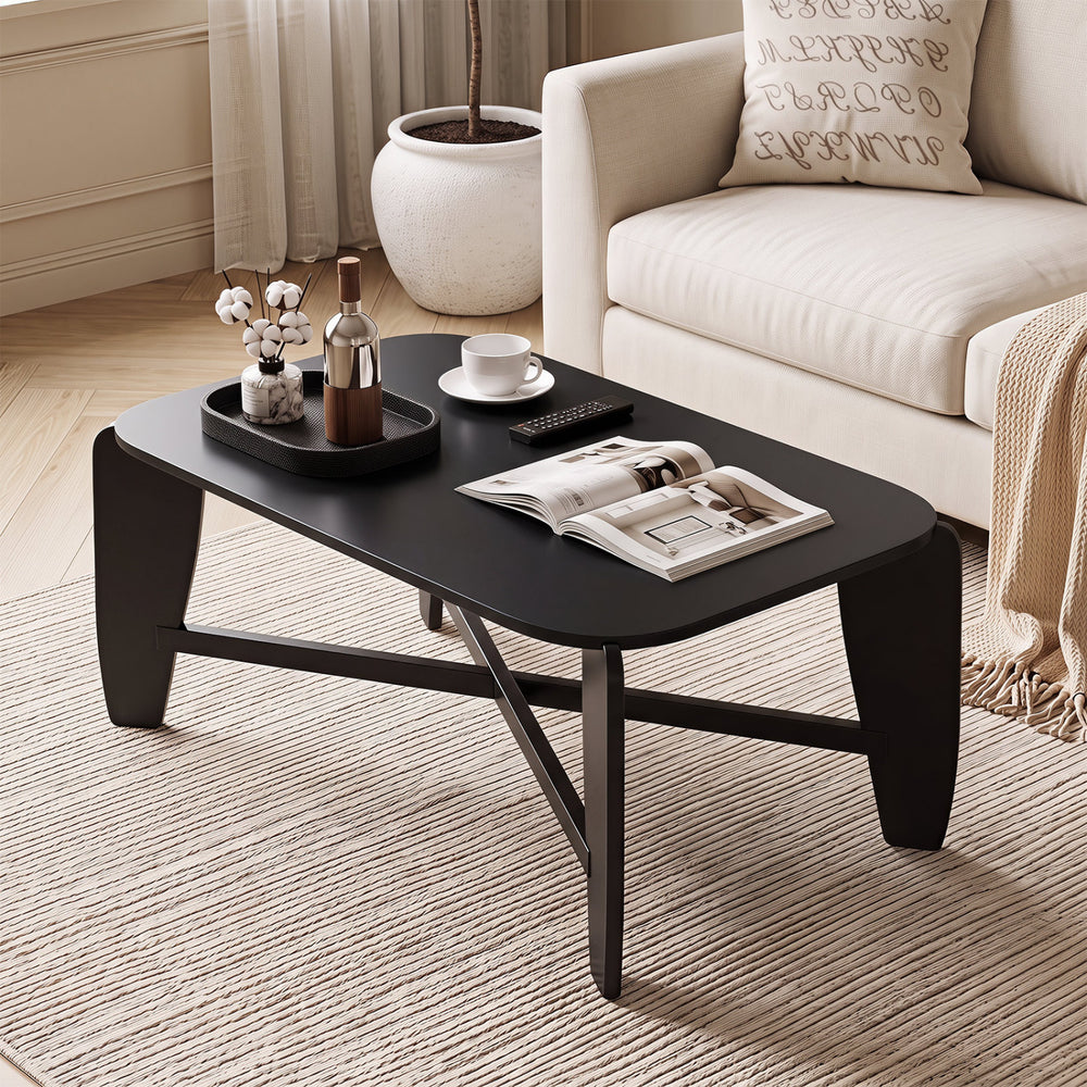 Stylish black coffee table with rubber wood cross-leg base, featuring rounded edges and a wide surface for decor and essentials.