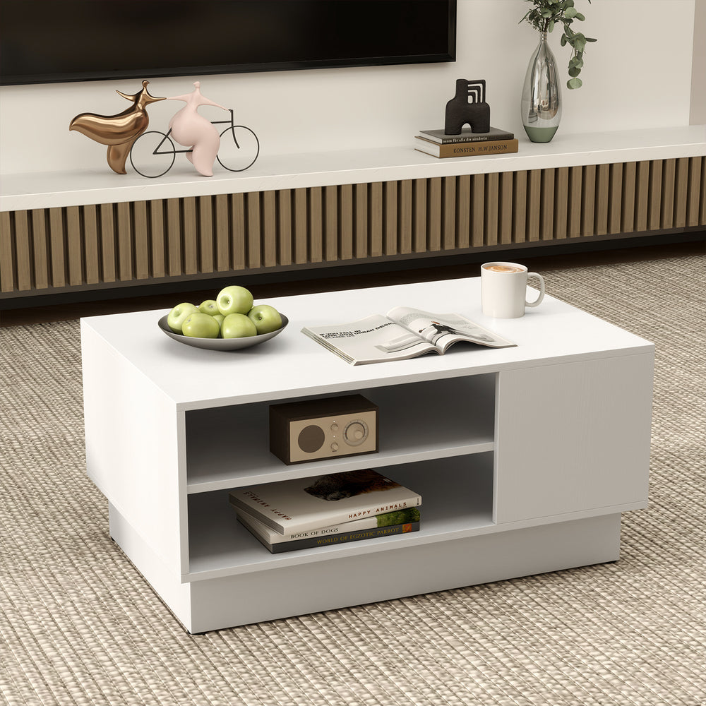 Modern coffee table in white showcasing open storage shelves and a stylish recessed base for contemporary living spaces.