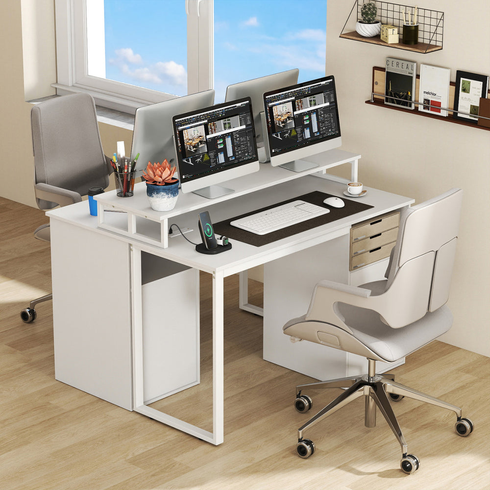 Modern computer desk in white with dual monitors, power outlets, and file drawer for an organized workspace.