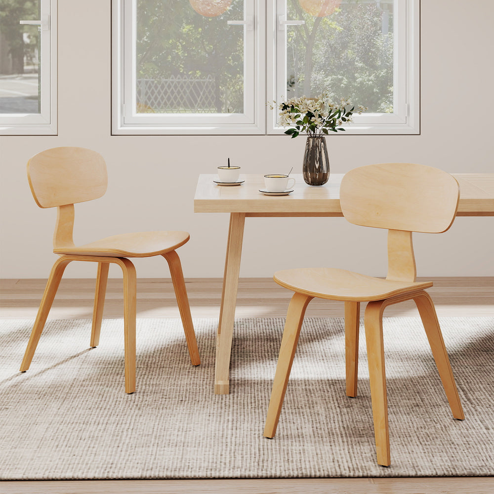 Natural wood dining chairs with ergonomic backrest, sturdy legs, and wide seat, perfect for kitchens and dining rooms.