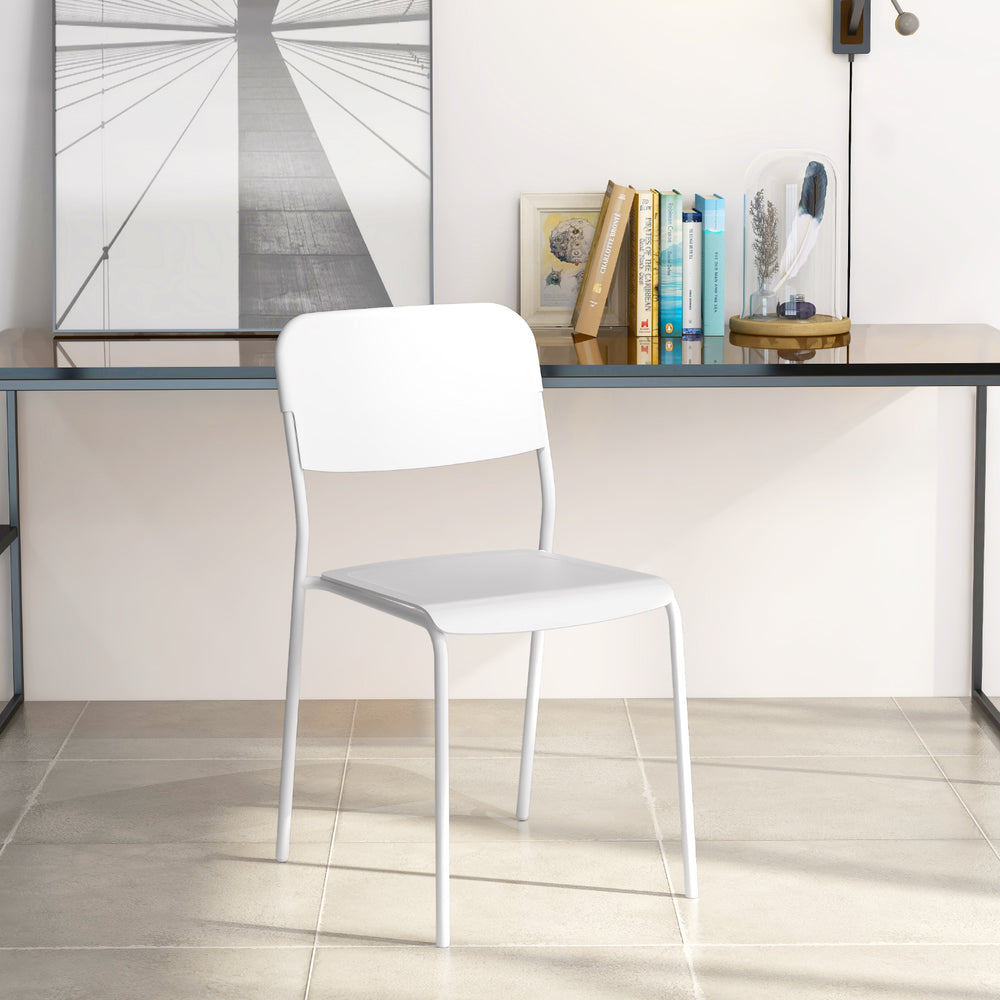 White modern dining chair with tilted backrest and sturdy metal legs, ideal for indoor or outdoor use.
