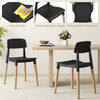 Set of 4 modern black dining side chairs with ergonomic backrest and sturdy beech legs, perfect for dining rooms.