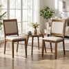 Two modern dining chairs with padded beige cushions and a brown rubber wood frame, perfect for any living or dining area.