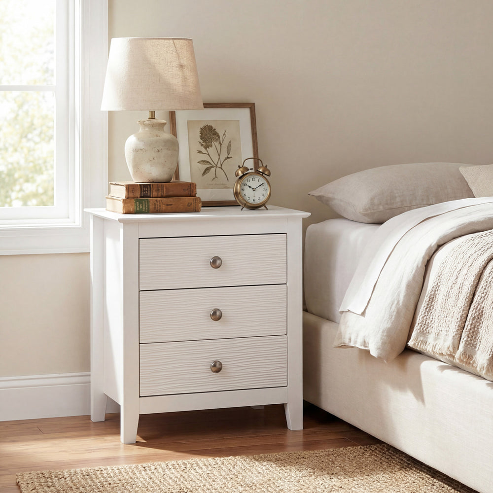 Modern Farmhouse 3-drawer nightstand in white with wood grain accents, ideal for bedside storage and decor.
