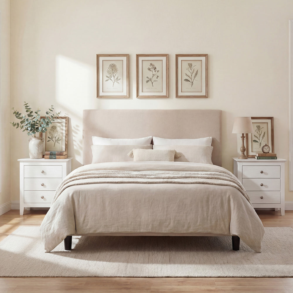 Modern farmhouse 3-drawer nightstand in white with wood grain accents, perfect for bedside storage and decor.