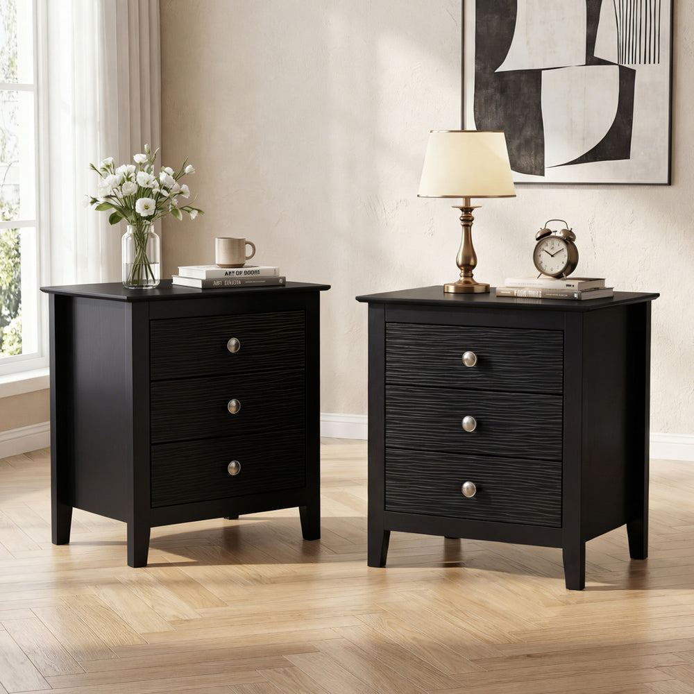 Black modern farmhouse 3-drawer nightstands with wood grain accents, perfect for bedroom storage and decor.