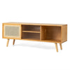 Modern TV stand in natural bamboo with rattan sliding doors and adjustable shelves for stylish storage.