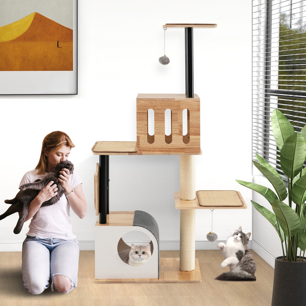 Modern tall cat tower with double condos, detachable sisal carpets, and dangling balls for playful kittens in a stylish.
