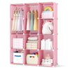 Modular pink baby wardrobe features 10 cubes, hanging rod, and shelves for organized storage in nurseries or playrooms.
